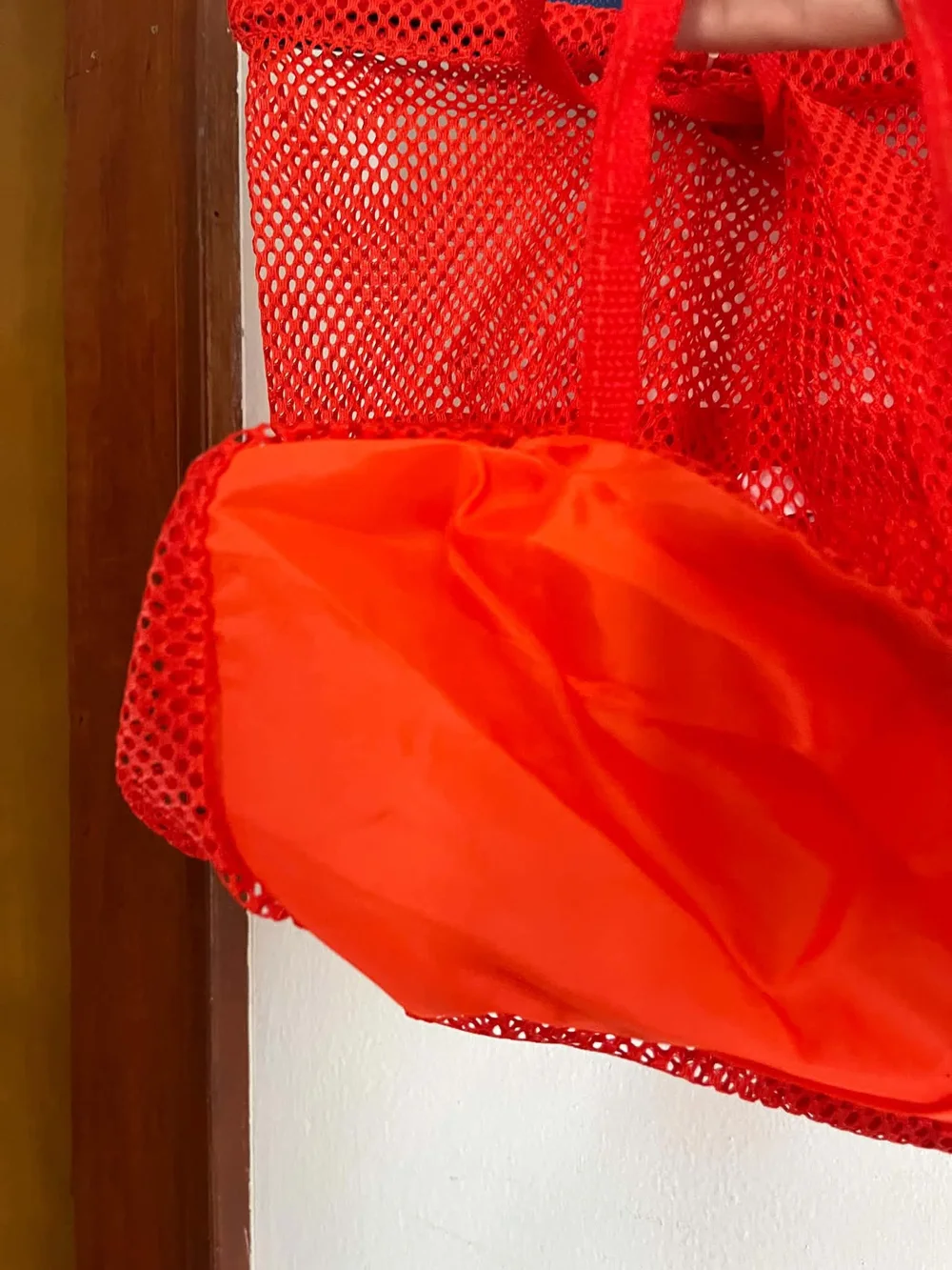 ASICS Bright Orange Mesh Drawstring Backpack